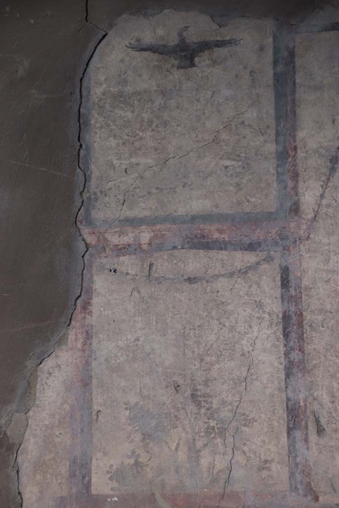 IV.21, Herculaneum. October 2020. Room 24, painted decoration of bird/eagle from panel on upper west wall in atrium. Photo courtesy of Klaus Heese.